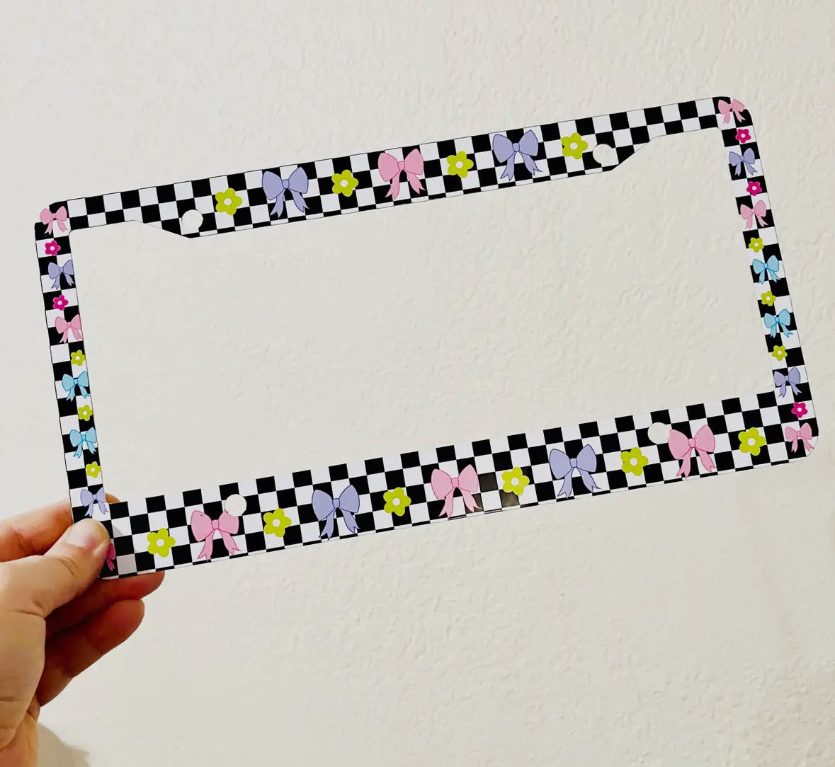 Checkered floral license plate cover